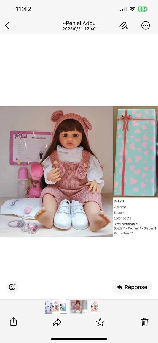 poupée reborn imitation vinyle avec de grands yeux et des cheveux longs 55cm